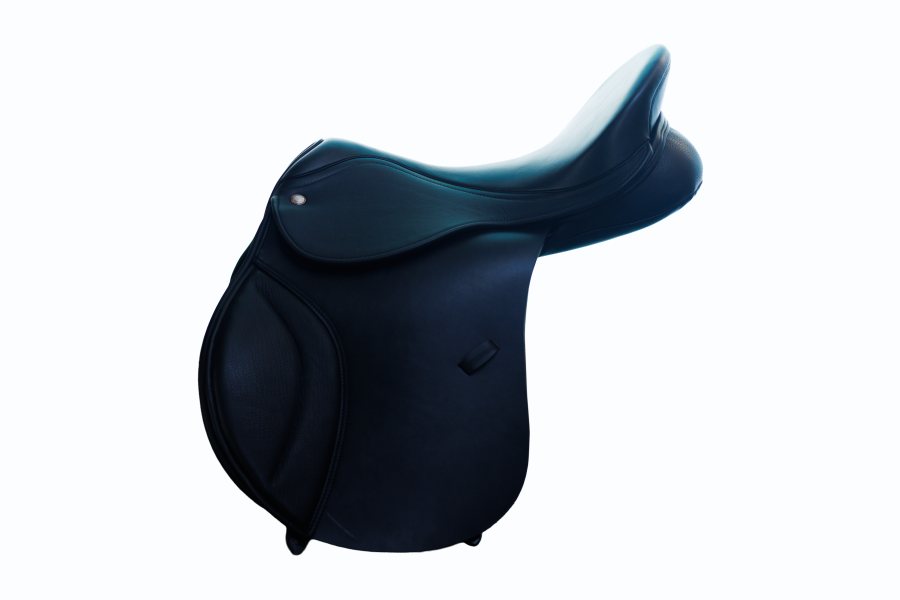 A dressage rider working a horse in a correctly fitted saddle